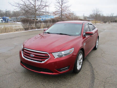2015 Ford Taurus for sale at Triangle Auto Sales in Elgin IL