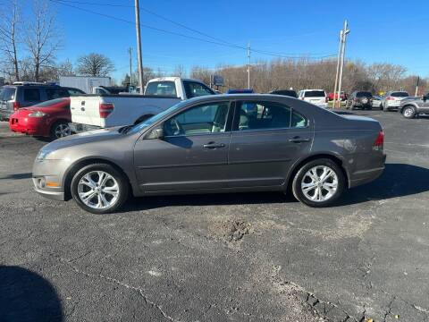 2012 Ford Fusion for sale at VILLAGE AUTO MART LLC in Portage IN