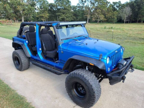 2016 Jeep Wrangler for sale at Classic Car Deals in Cadillac MI