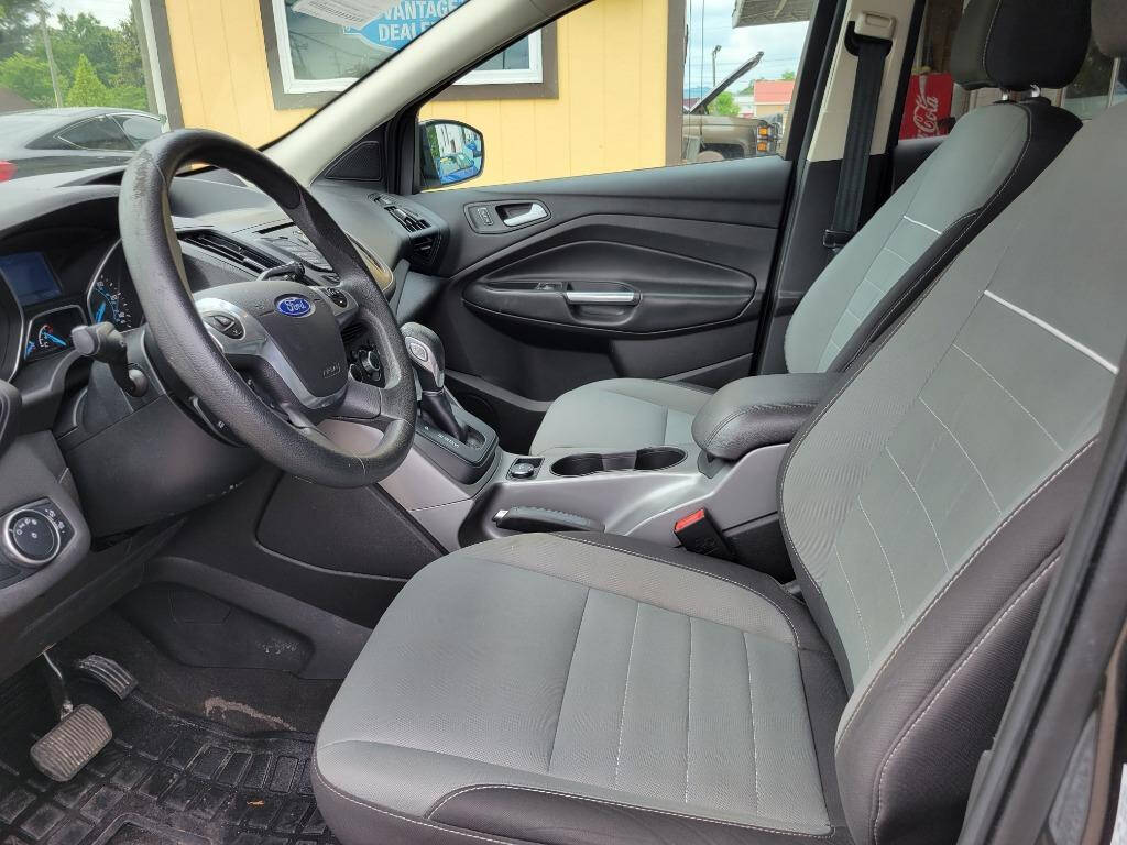 2015 Ford Escape for sale at DAGO'S AUTO SALES LLC in Dalton, GA