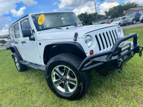 2011 Jeep Wrangler Unlimited for sale at Unique Motor Sport Sales in Kissimmee FL
