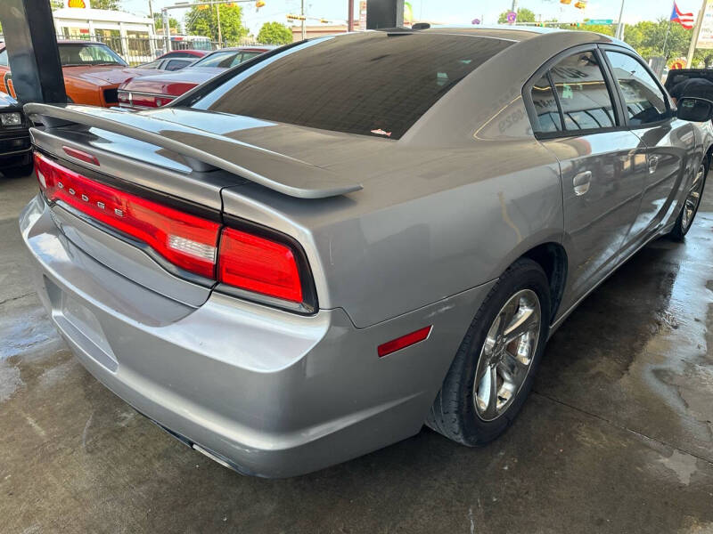 2014 Dodge Charger for sale at Buy-Fast Autos in Houston TX