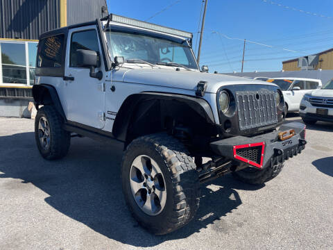 2009 Jeep Wrangler for sale at BELOW BOOK AUTO SALES in Idaho Falls ID