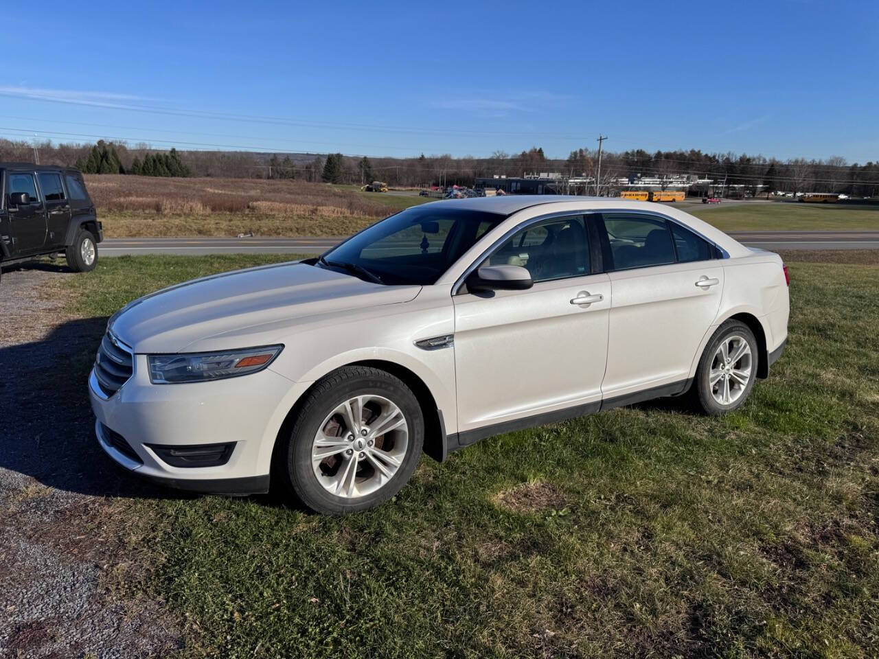 2013 Ford Taurus for sale at Riverside Motors in Glenfield, NY