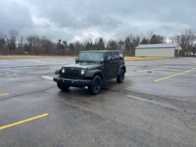 2010 Jeep Wrangler Unlimited for sale at Caruzin Motors in Flint MI