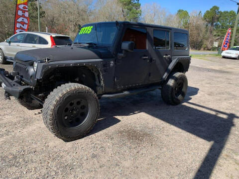 2014 Jeep Wrangler Unlimited for sale at Johnson's Auto Sales in Douglas GA