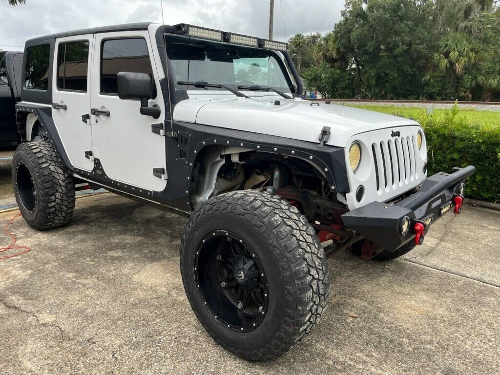 2013 Jeep Wrangler Unlimited for sale at Putnam Motors in Pomona Park, FL