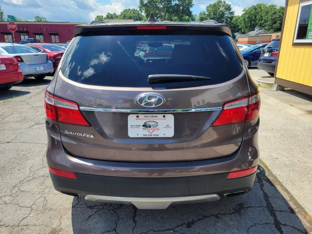 2015 Hyundai SANTA FE for sale at DAGO'S AUTO SALES LLC in Dalton, GA