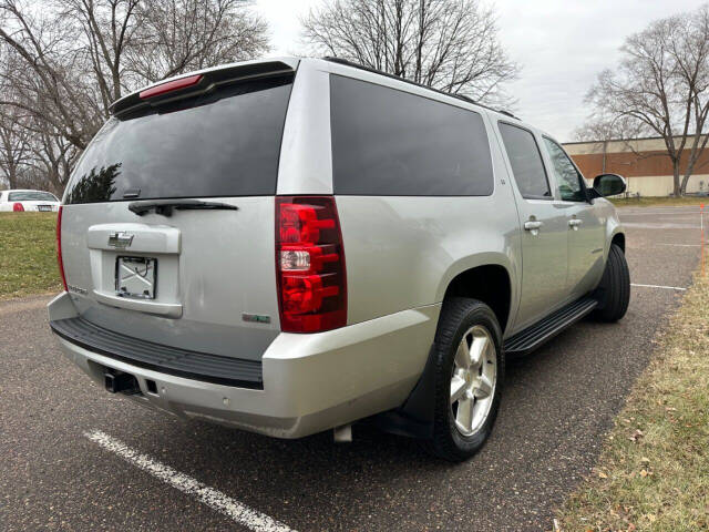 2011 Chevrolet Suburban for sale at JUST AUTOS in MINNEAPOLIS, MN