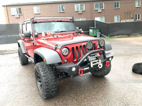 2011 Jeep Wrangler Unlimited for sale at McManus Motors in Wheat Ridge CO