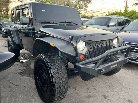 2011 Jeep Wrangler Unlimited for sale at Plus Auto Sales in West Park FL