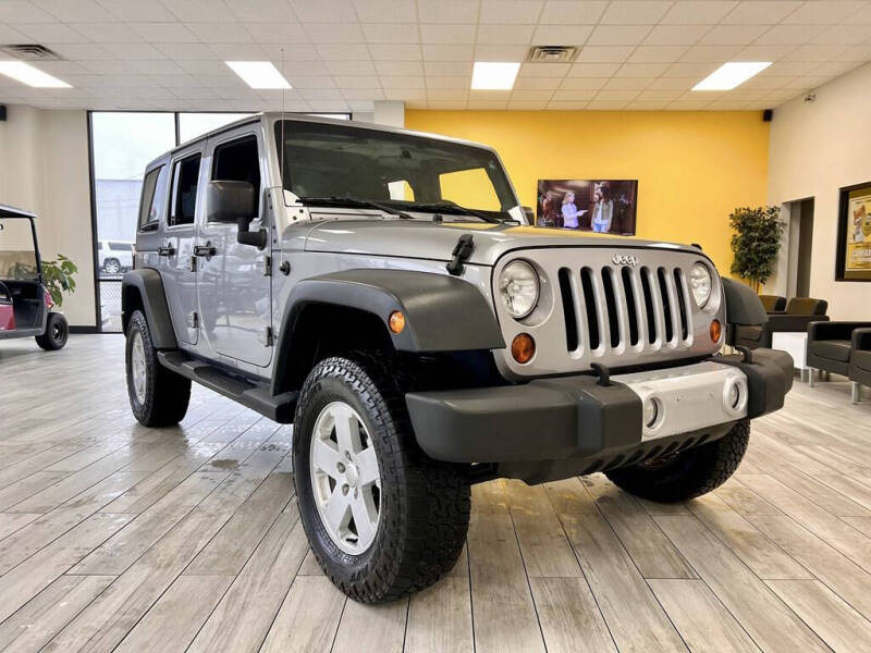 2013 Jeep Wrangler Unlimited for sale at Dixie Motors Inc. in Tuscaloosa AL