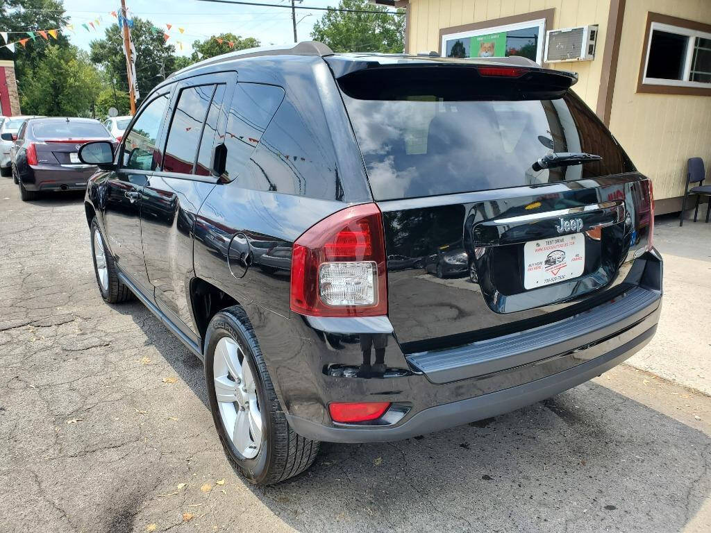 2016 Jeep Compass for sale at DAGO'S AUTO SALES LLC in Dalton, GA