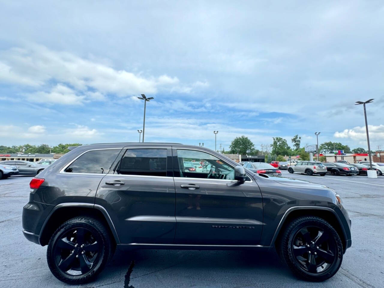 2015 Jeep Grand Cherokee for sale at Opus Motorcars in Utica, MI