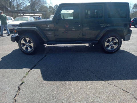 2016 Jeep Wrangler Unlimited for sale at WALKER MOTORS LLC & TRAILERS in Hattiesburg MS