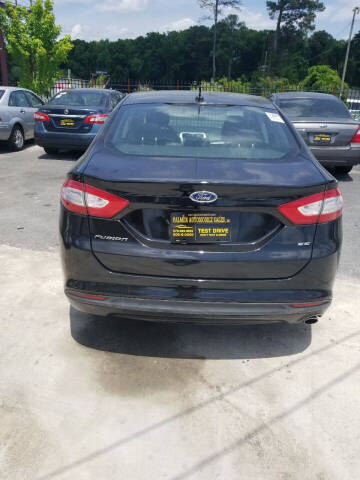 2013 Ford Fusion for sale at Palmer Automobile Sales in Decatur GA