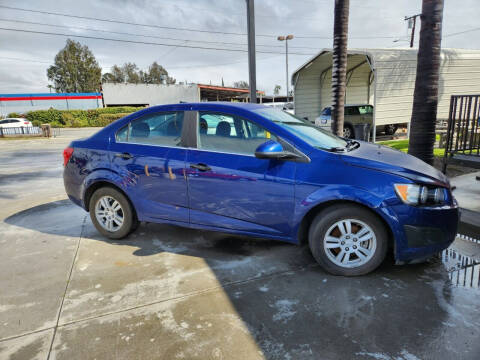 2014 Chevrolet Sonic for sale at E and M Auto Sales in Bloomington CA