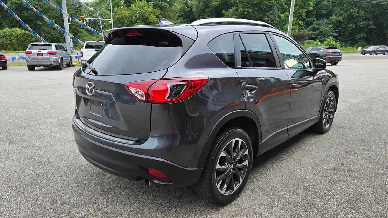 2016 Mazda CX-5 for sale at North Ridge Auto Center LLC in Madison, OH