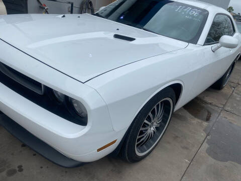 2013 Dodge Challenger for sale at Buy-Fast Autos in Houston TX