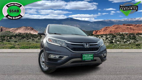 2015 Honda CR-V for sale at Street Smart Auto Brokers in Colorado Springs CO