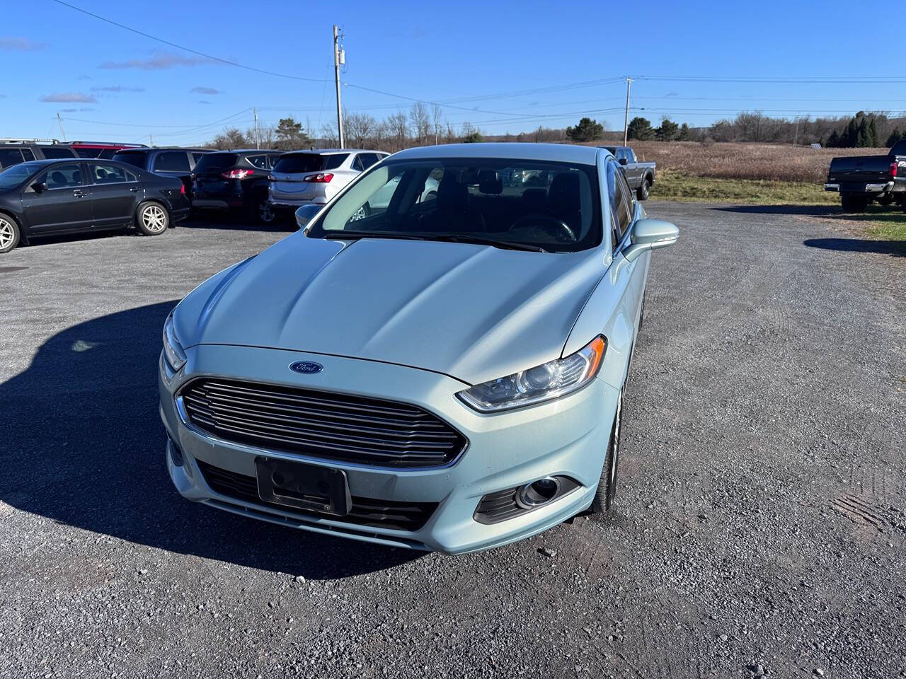 2014 Ford Fusion Hybrid for sale at Riverside Motors in Glenfield, NY