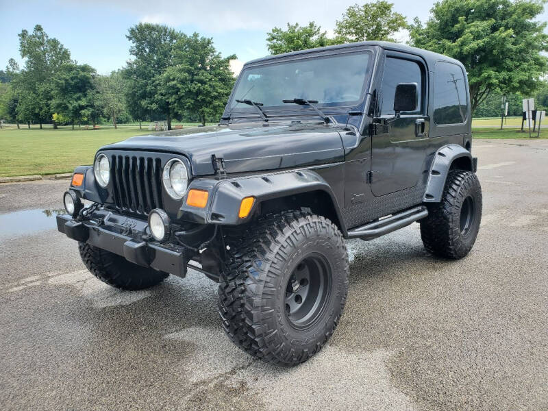 1999 Jeep Wrangler for sale at ELLENBURG MOTORS LLC in Franklin OH