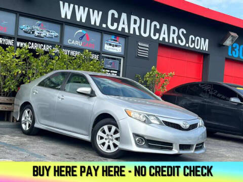 2014 Toyota Camry for sale at CARUCARS LLC in Miami FL