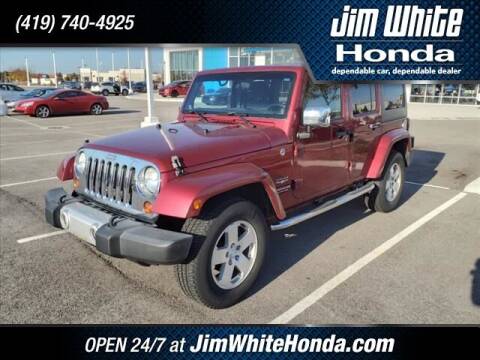 2012 Jeep Wrangler Unlimited for sale at The Credit Miracle Network Team at Jim White Honda in Maumee OH