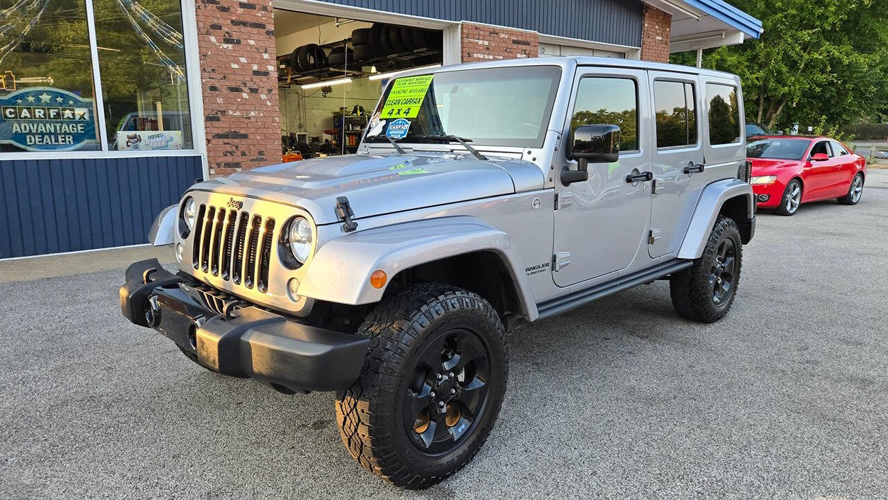 2015 Jeep Wrangler Unlimited for sale at North Ridge Auto Center LLC in Madison, OH