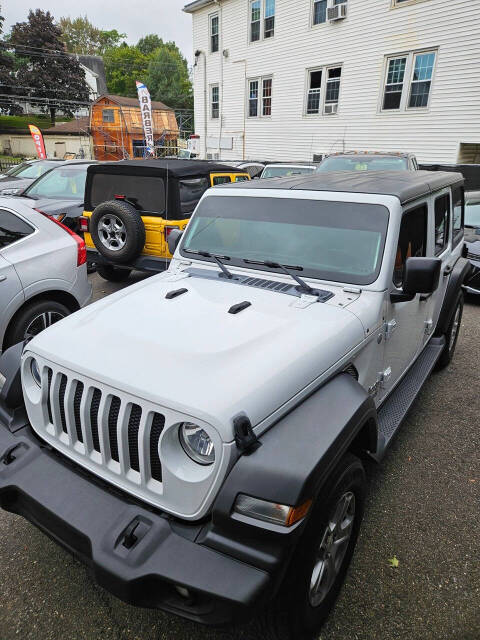 2019 Jeep Wrangler Unlimited for sale at RENOS AUTO SALES LLC in Waterbury, CT