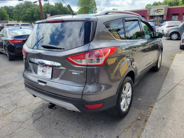 2014 Ford Escape for sale at DAGO'S AUTO SALES LLC in Dalton, GA