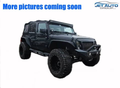 2014 Jeep Wrangler Unlimited for sale at JET Auto Group in Cambridge OH