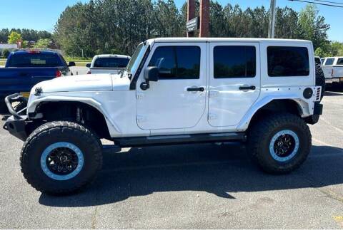 2013 Jeep Wrangler Unlimited for sale at CU Carfinders in Norcross GA