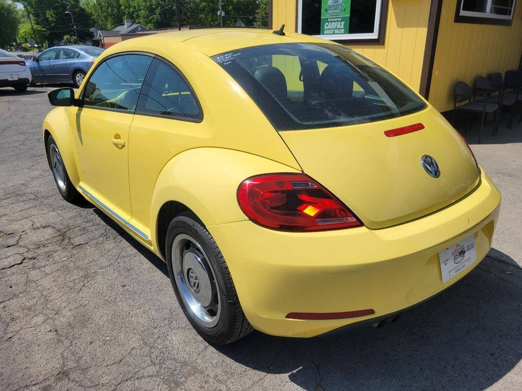 2012 Volkswagen Beetle for sale at DAGO'S AUTO SALES LLC in Dalton, GA