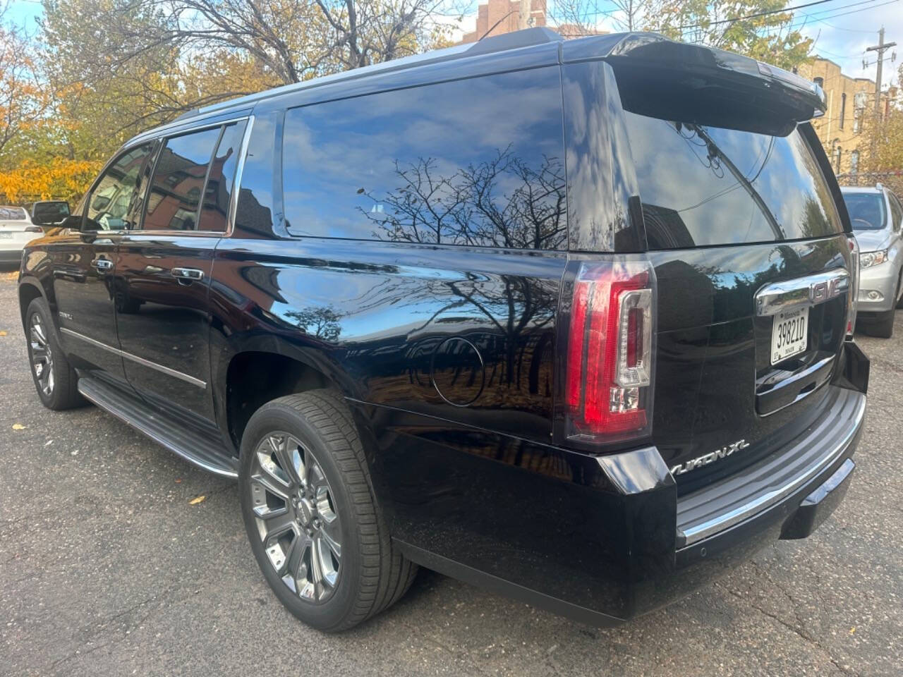 2015 GMC Yukon XL for sale at JUST AUTOS in MINNEAPOLIS, MN