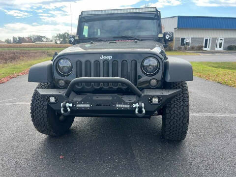 2009 Jeep Wrangler Unlimited for sale at Revolution Auto Inc in McHenry IL