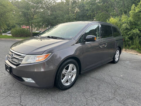 2012 Honda Odyssey for sale at Triangle Motors Inc in Raleigh NC