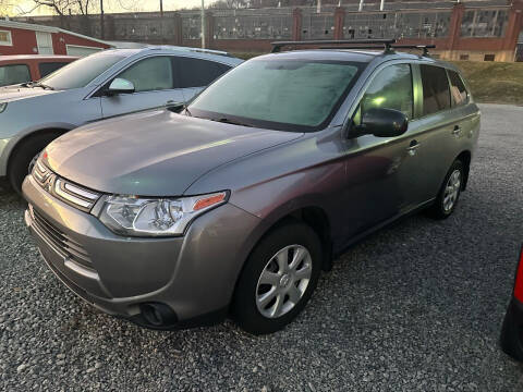 2014 Mitsubishi Outlander for sale at SAVORS AUTO CONNECTION LLC in East Liverpool OH