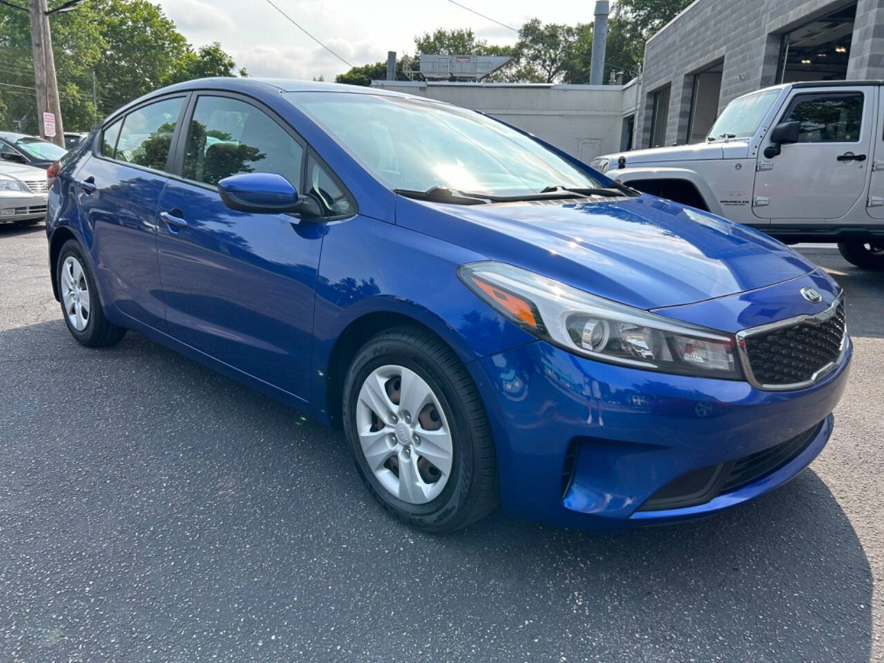 2017 Kia Forte for sale at Auto Shop in Wyoming, MI