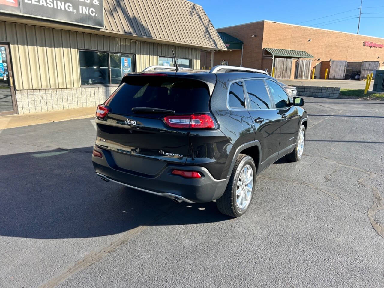 2014 Jeep Cherokee for sale at Wyrick Auto Sales & Leasing Inc in Zeeland, MI