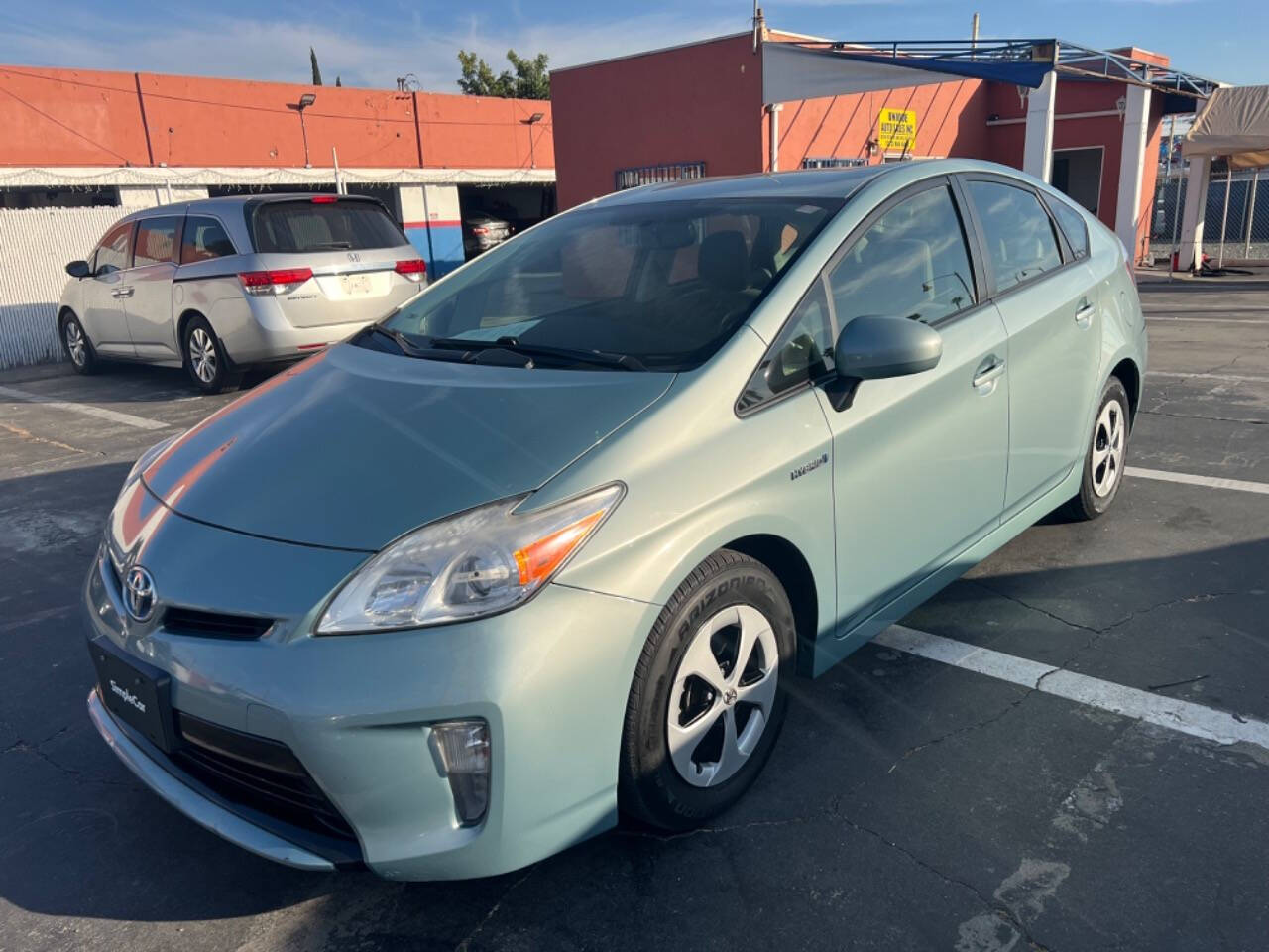 2012 Toyota Prius for sale at Unique Auto Sales, Inc. in Bell, CA