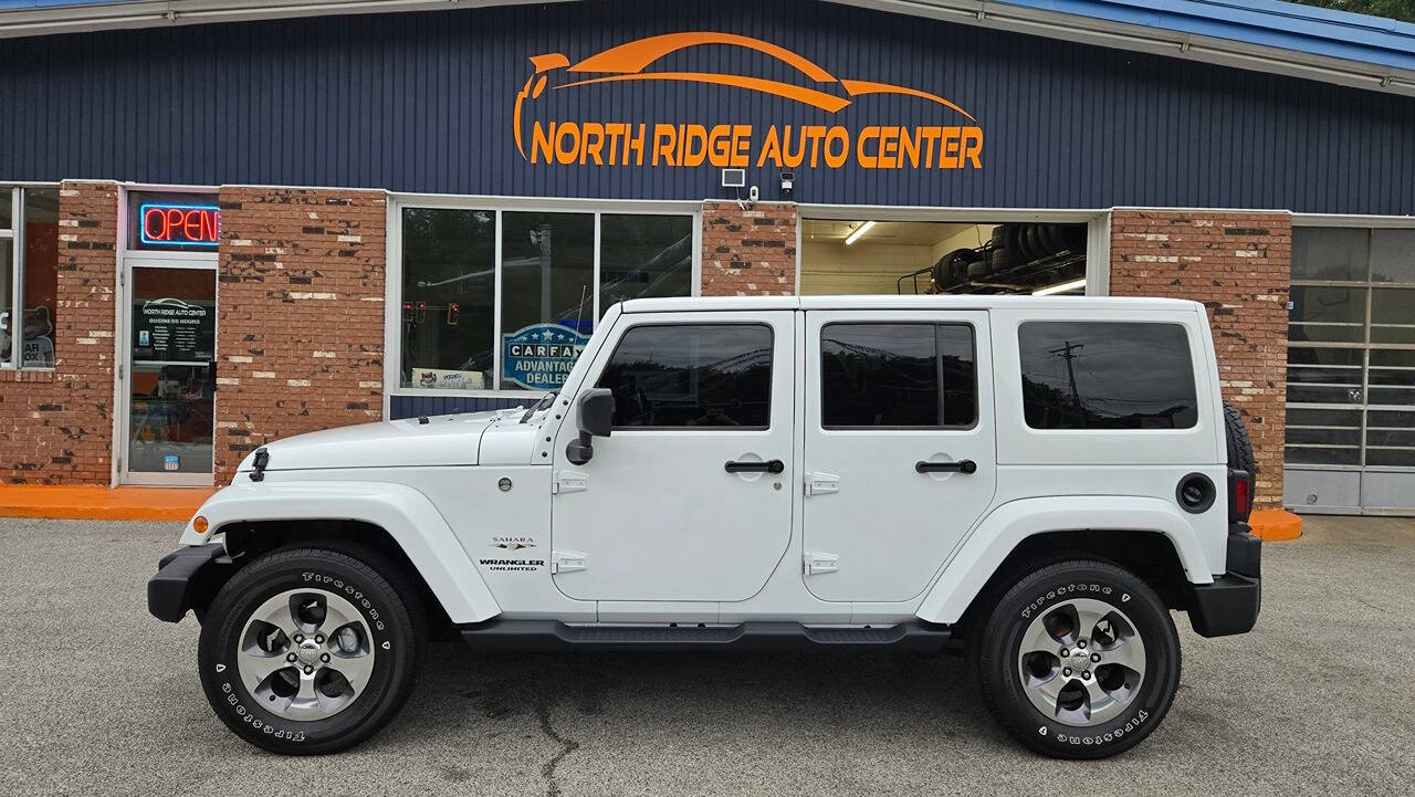 2016 Jeep Wrangler Unlimited for sale at North Ridge Auto Center LLC in Madison, OH