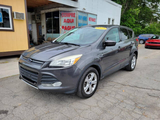 2015 Ford Escape for sale at DAGO'S AUTO SALES LLC in Dalton, GA