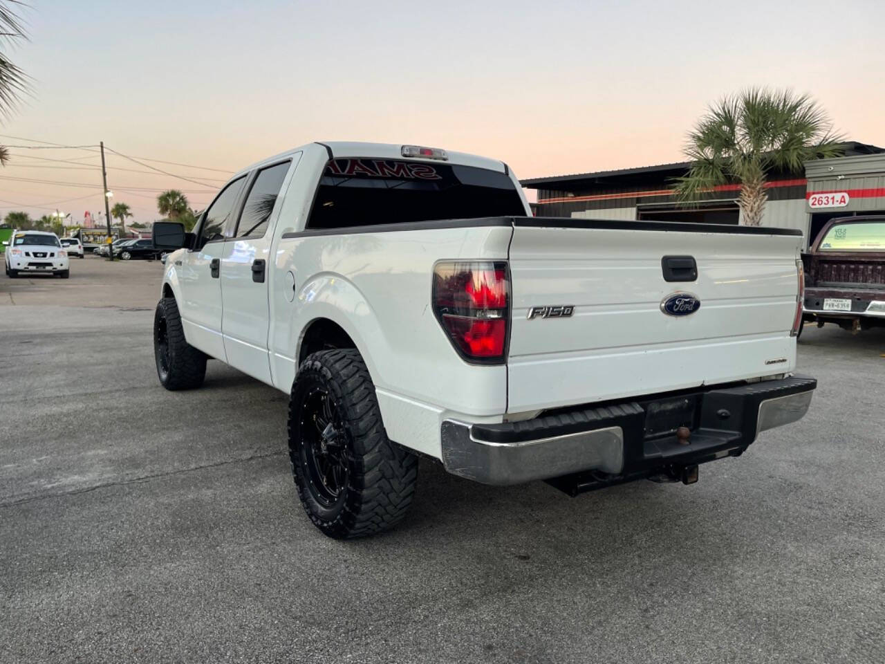 2009 Ford F-150 for sale at SMART CHOICE AUTO in Pasadena, TX