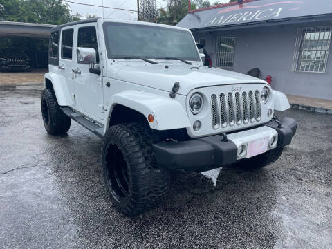 2014 Jeep Wrangler Unlimited for sale at America Auto Wholesale Inc in Miami FL