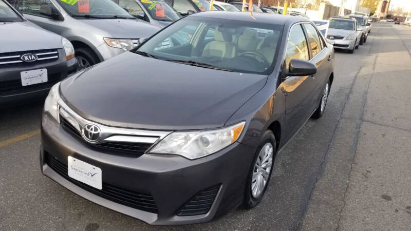 2012 Toyota Camry for sale at Howe's Auto Sales in Lowell MA