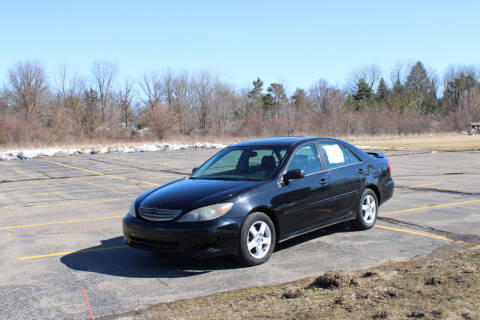 2002 Toyota Camry for sale at Caruzin Motors in Flint MI