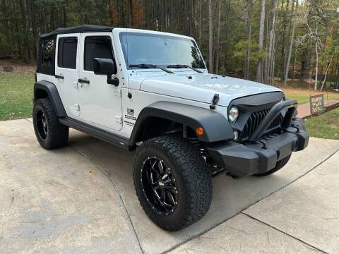 2015 Jeep Wrangler Unlimited for sale at United Automotive Group in Griffin GA