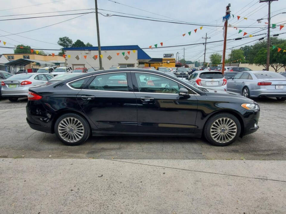 2016 Ford Fusion for sale at DAGO'S AUTO SALES LLC in Dalton, GA