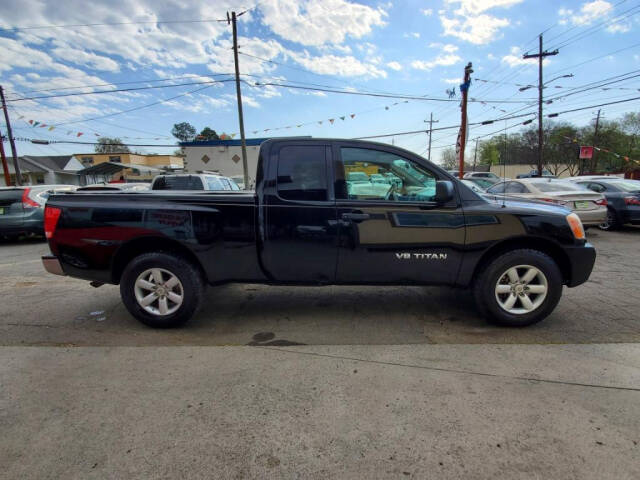 2011 Nissan Titan for sale at DAGO'S AUTO SALES LLC in Dalton, GA